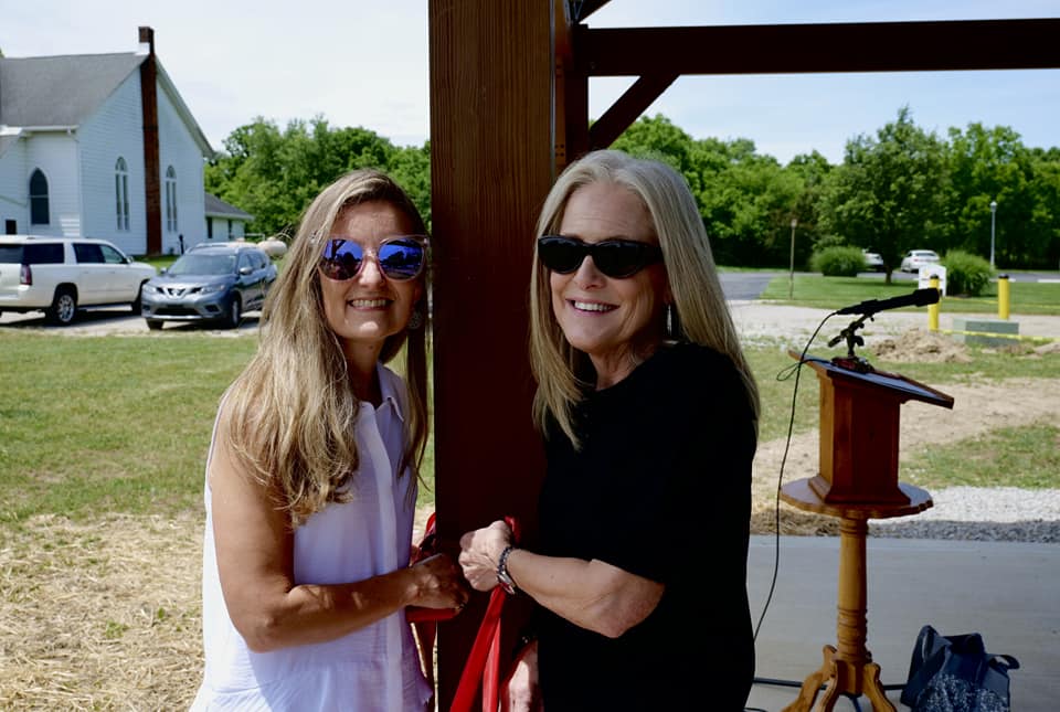 Amy Margraff and Pam Walker pose under the new pavilion