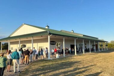 people waiting in line to enter the event